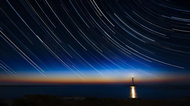 2017-04 Circumpolar trails sunset at La Hague lighthouse